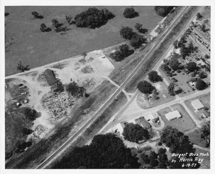 Aerial view of burned citrus packing house Valrico Florida 1957