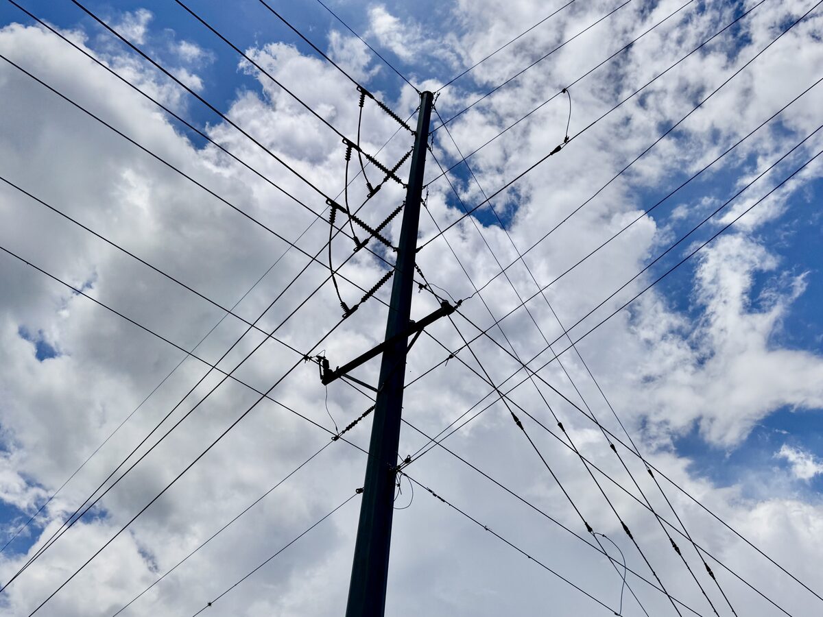 TECO highline wire junction pole against clouds in Valrico, FL
